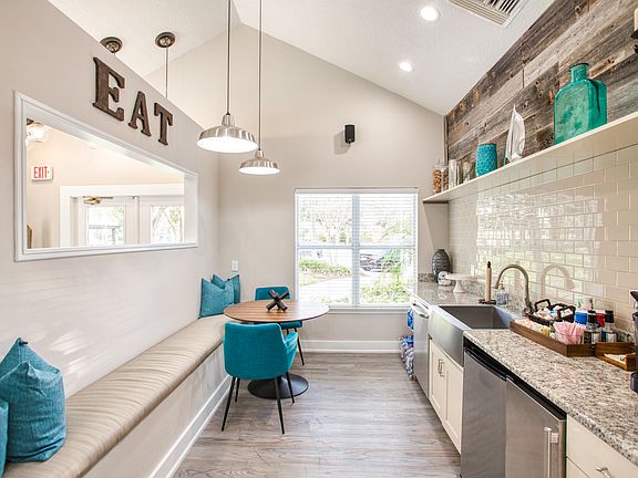 Audubon Village - Image of the newly renovated resident club house kitchen with a bench for seating.