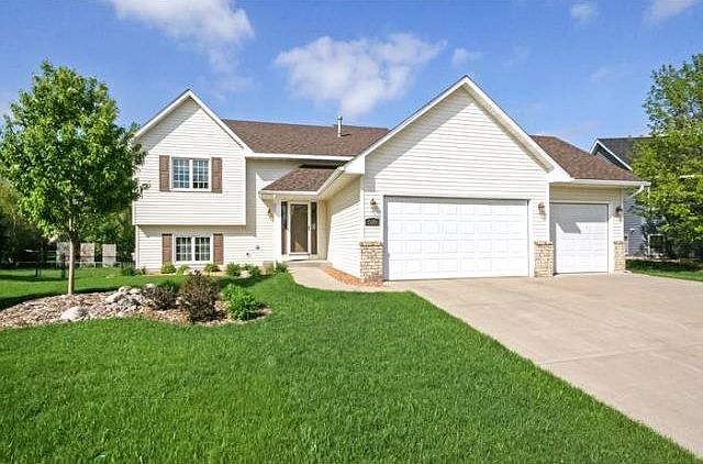 New roof, 3 car garage and great curb appeal