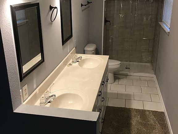Master bath includes walk-in shower and dual vanity.