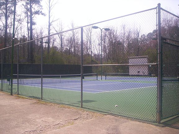creekside tennis courts beside the house