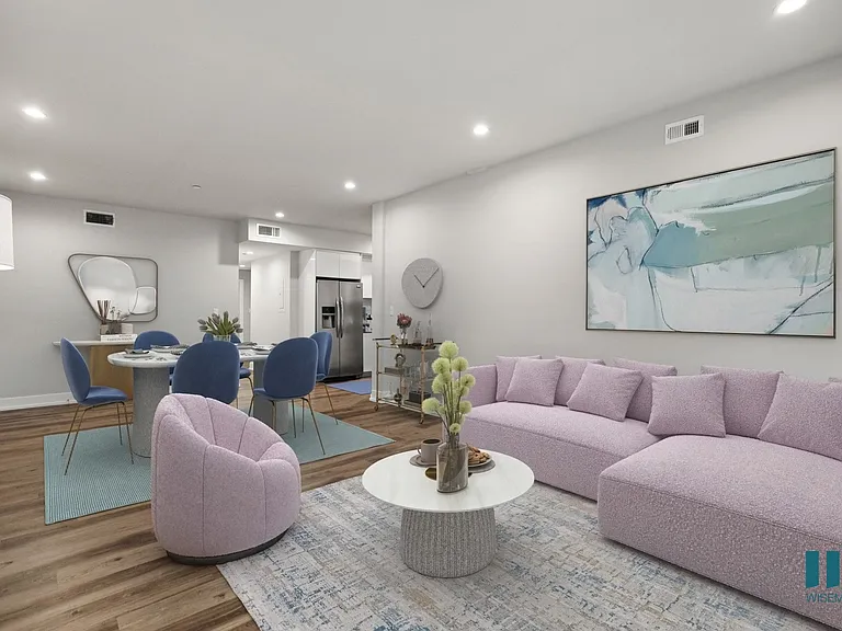 Open-Concept Kitchen, Dining, and Living Room with Vinyl Flooring and Recessed Lighting