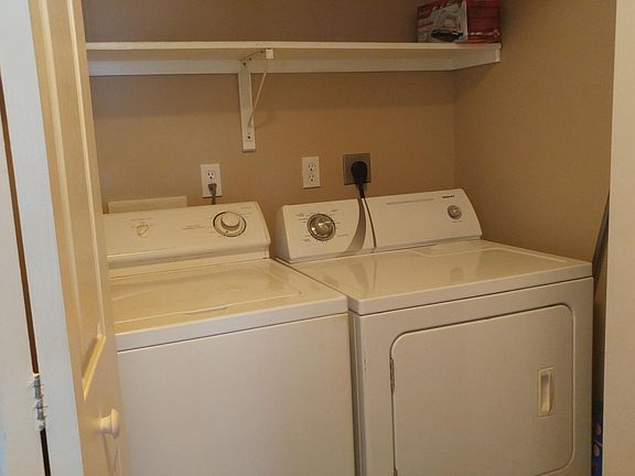 Large capacity washer and dryer with extra storage space abo