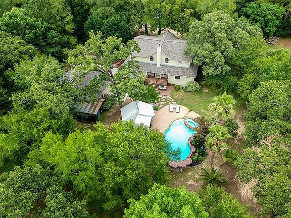 Love being surrounded by the beautiful outdoors - you will have that and more at this home that is very secluded away in the forest of trees