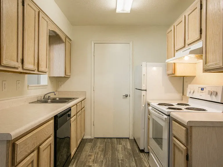 Kitchen with rich light wood cabinetry