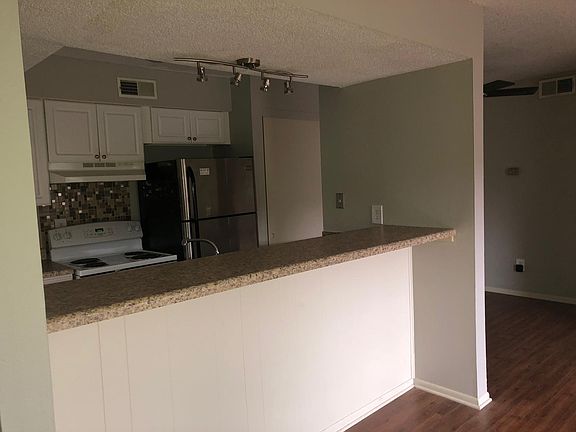 Modern lighting above breakfast bar, beautiful backsplash