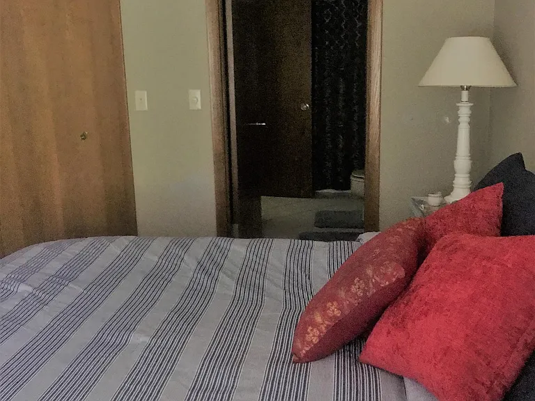 Door from Master bedroom to bathroom. 2nd door in bathroom to small hallway to living-dining area.