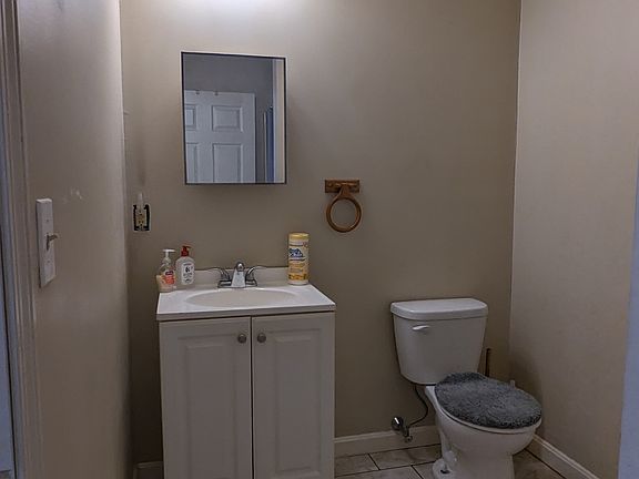 Spascious bathroom with tiles floor