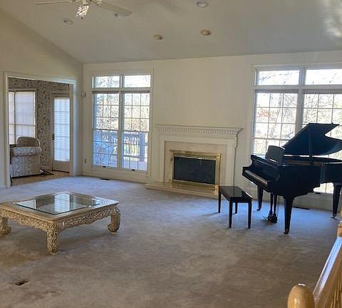 Living room with fireplace and option for Baby Grand