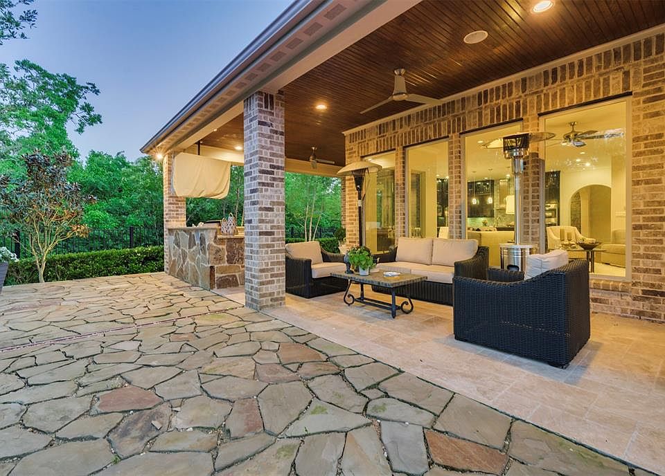 Welcome to Paradise!! With Walls of Windows wrapping around the home the views out of the home and into the home from the expansive Covered Patio and Outdoor Kitchen are a visual overload like out of an upscale magazine!