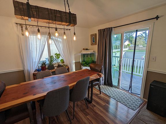 Dining room with sliding glass door leading to fenced yard