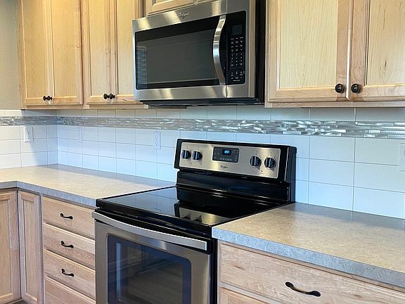 Smooth cooktop and built-in microwave.