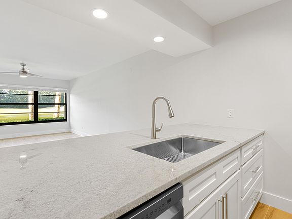Bask in stunning lake & golf course views from your brand new kitchen & breakfast bar!