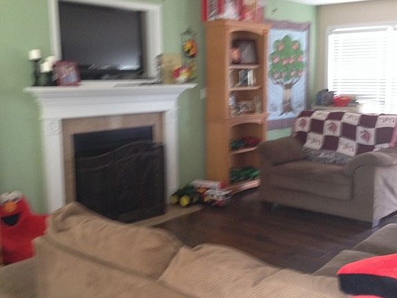 Spacious living room with a gas fire place.