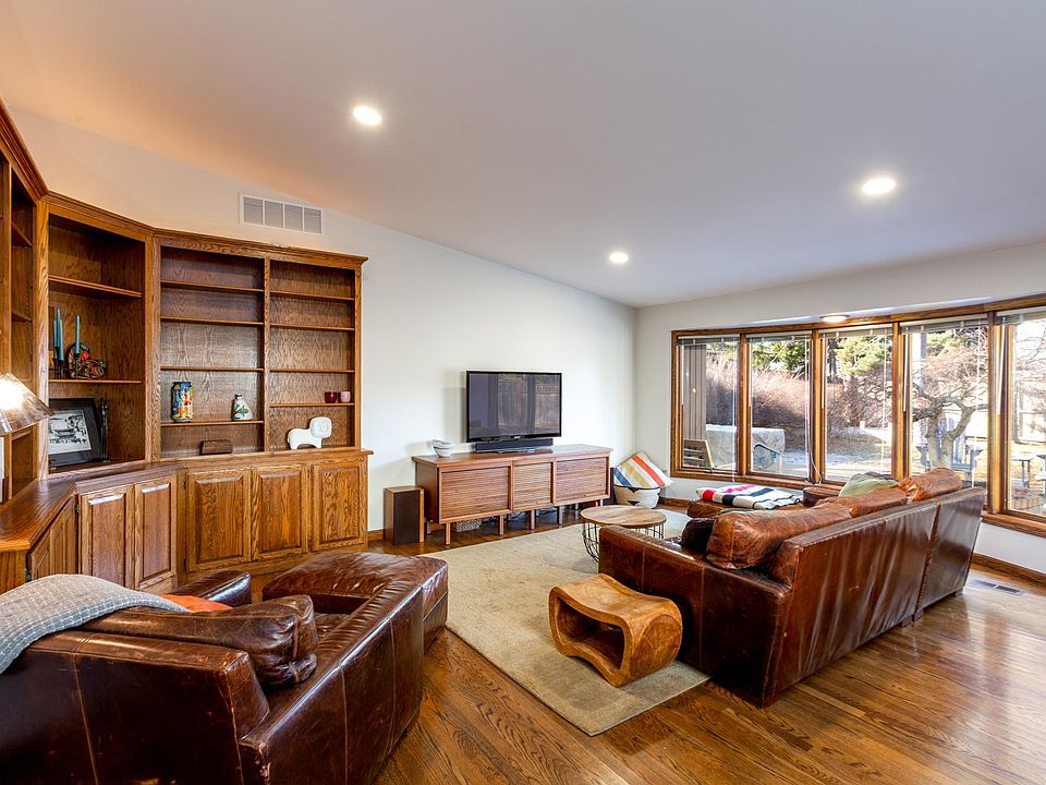 Large living room with vaulted ceiling and skylight.