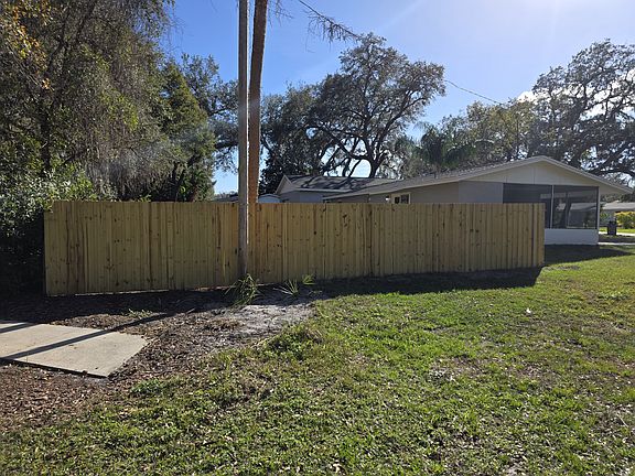 Corner side of fenced backyard