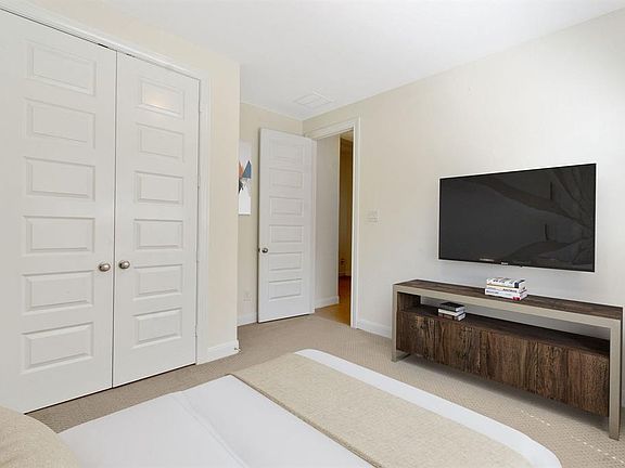 Front secondary bedroom located across from study and next to full bathroom (virtually staged)