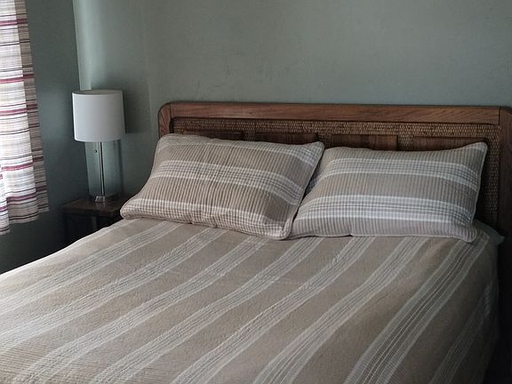 Queen bedroom. No closet or dresser. This is a small office converted to an extra sleeping area.