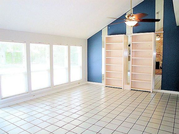 Another view of the family room featuring the "wall" of windows (lots of natural light and more buil