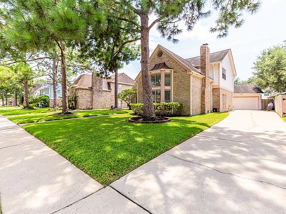The wide driveway that leads to the detached, two car garage offers plenty of off-street parking for both homeowners and guests.