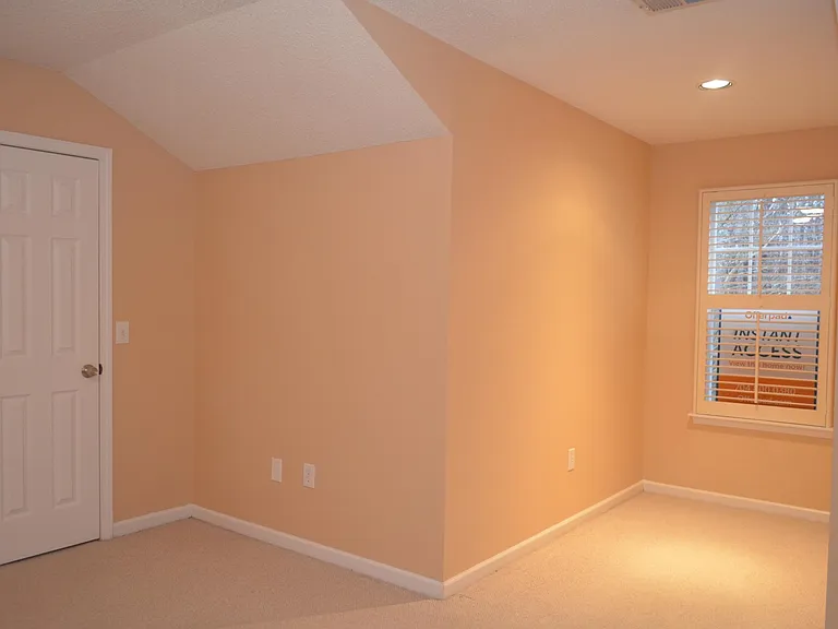 Second floor bedroom with office nook or play area.