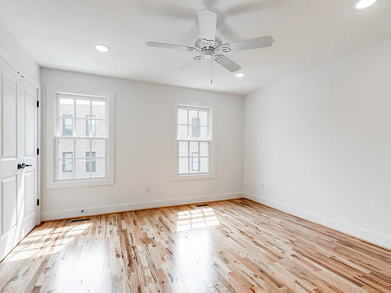 Third bedroom offers hardwoods, ceiling fan, recessed lights, and 2 closets