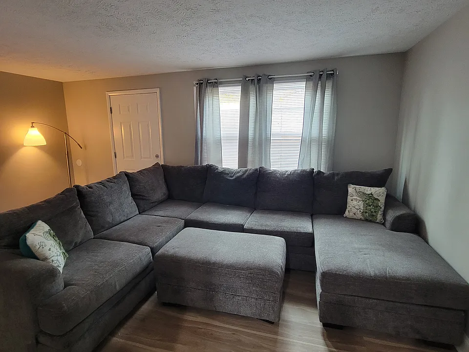 Living room with section and 55 in TV