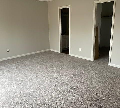 master bedroom with bathroom and has 2 large closets