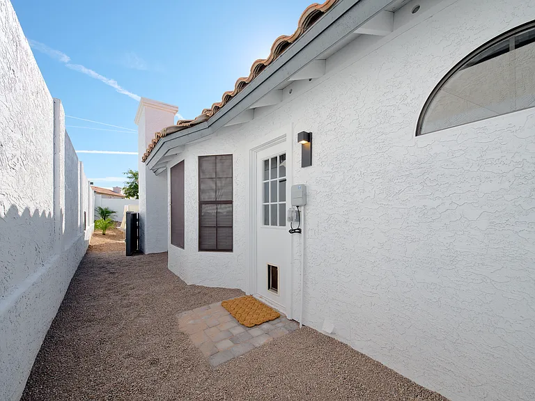 Pet Door Leads to Soft Scape Dog Run w/Gate