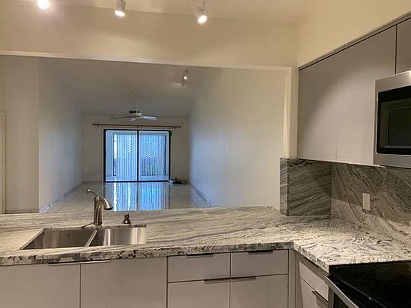 Kitchen facing the living room (washer dryer are in a utility room behind this photo