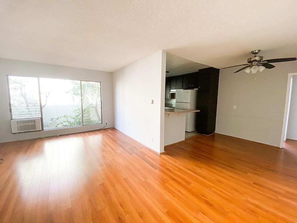 Large, bright living room with a separate dining area.