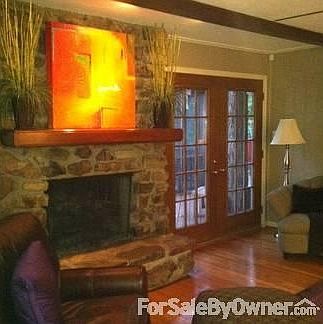 Den
						:
						Cozy den with woodburning fireplace with gas logs and hardwood floors