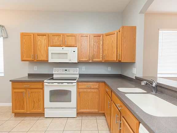 Plenty of cabinetry in kitchen with view into great room