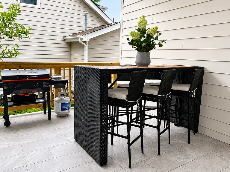 Blending indoor meals with outdoor dining, fresh air, and grilling. Your view from the dining room to your own private outdoor deck with alfresco dining and Blackstone grill.