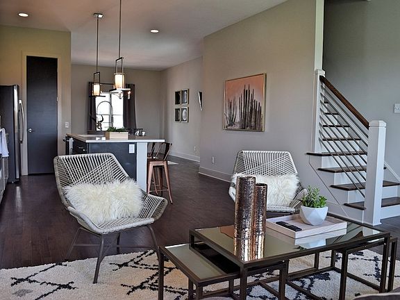 Relax in this living room with so much natural light.