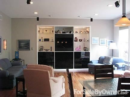 Family room facing east
						:
						Custom entertainment center and built-in surround sound. Hardwood flooring.