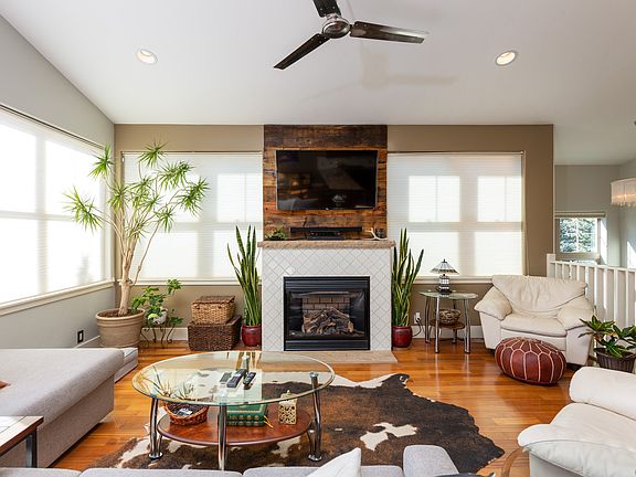 Great Room with wraparound windows and plenty of natural light. Mountain Modern Decor.