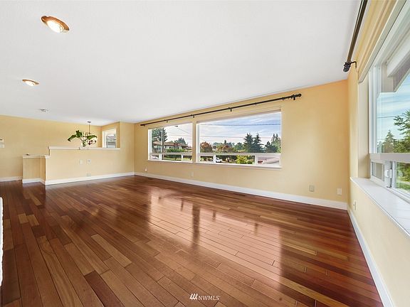 From a different angle looking back at the extensive upstairs family room and SW facing windows for lots of natural light. 
