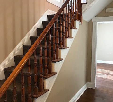 View stairway and hallway to living/dining room from front d