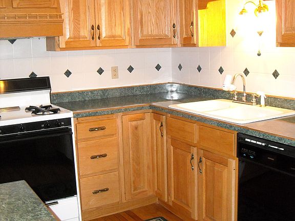 one side of kitchen - note dishwasher and gas oven - French door refrigerator is just out of sight in this photo
