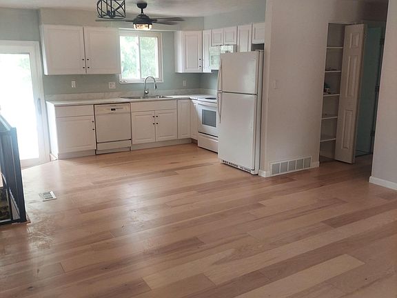 New kitchen and dining area. Sliding glass door onto new trek deck