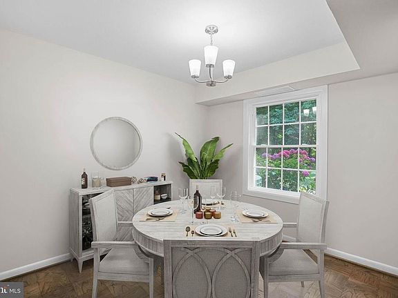 Dining room off the kitchen. Furniture is not included - only shown for staging.