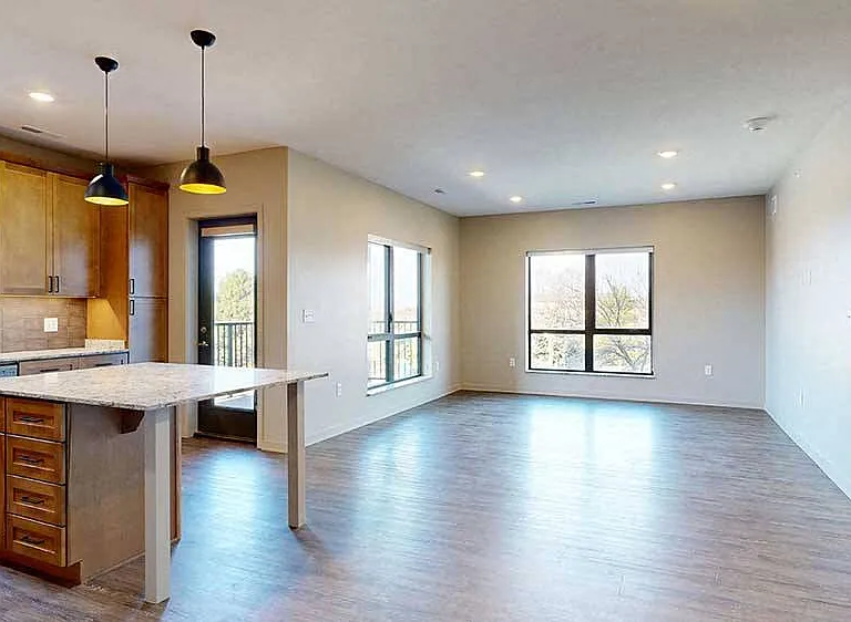 Expansive and light-filled, the open-concept living room of our two-bed Meadow is perfect for entertaining or unwinding in style.