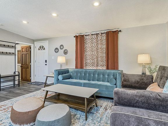 Stylish living room with a couch that converts to a full sized bed!