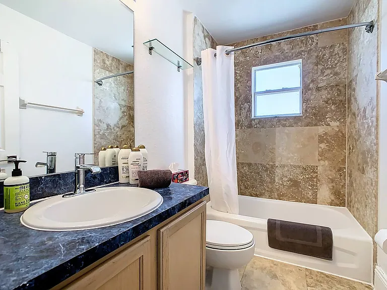 A soothing oasis with a shower and bathtub combo, providing the perfect retreat after a day of adventures.
