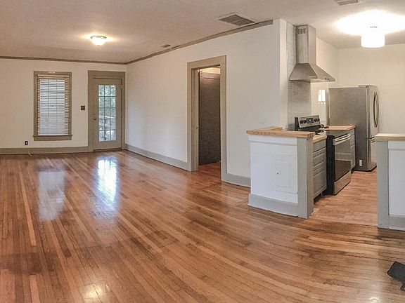The front of the house has an open concept with the living r