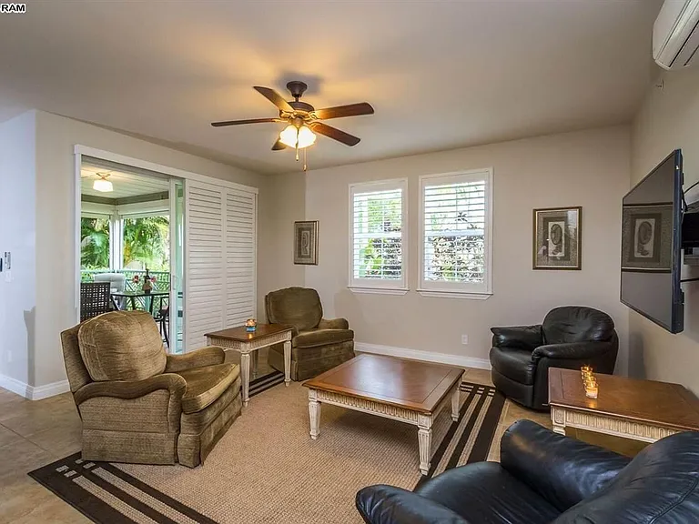 Living room with 2 recliners and 2 swivel rockers, wide screen TV