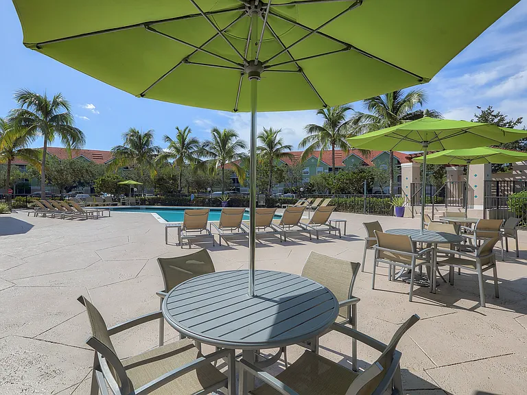 Poolside tables and umbrellas