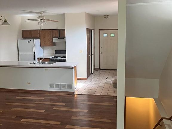 View of living room into the kitchen and foyer.