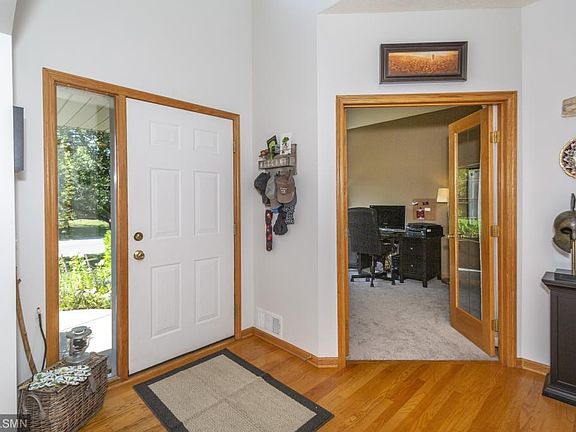 Front entrance looking into office. Hardwood floors.