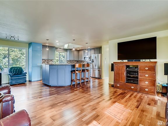 Another view of the easy flow floor plan from the living space to the open kitchen and breakfast bar.